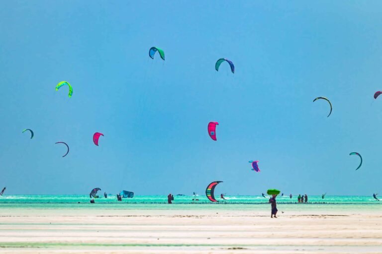 Kiteboarders-riding-the-waves-at-Paje-Beach-Zanzibar-Easy-Travel-Tanzania-scaled-1